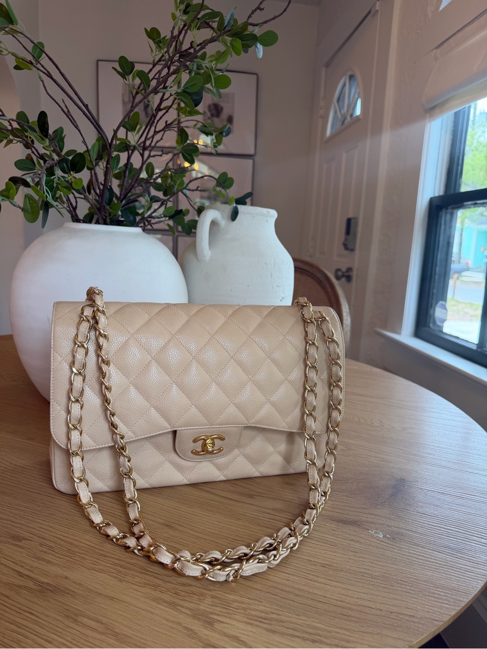 CHANEL classic jumbo double flap bag in beige caviar leather with gold hardware